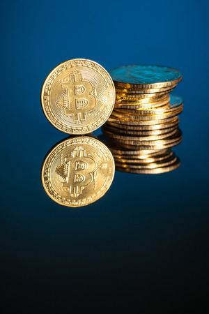 bitcoin with blue background technology with tablet and smartphone の写真素材