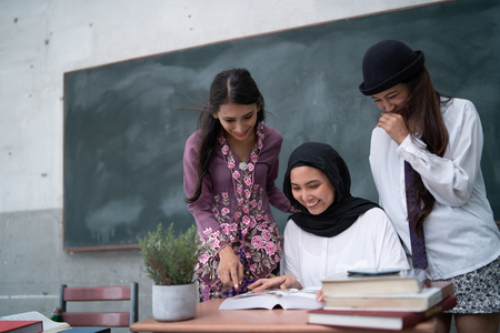 a group of teacher is learing with each other in a class roomの写真素材