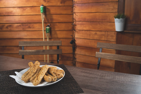 delicious malaysian traditional food lekor on wood theme backgroundの写真素材