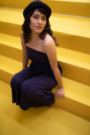 asian woman at yellow stair case