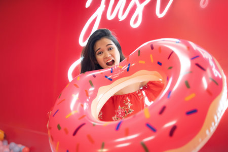 beautiful asian teenage playing and having fun at ball pool
