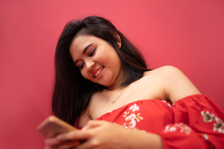 asian teenage girl with smartphoneの写真素材