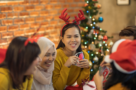 asian indoor having fun at christmas indoorの写真素材