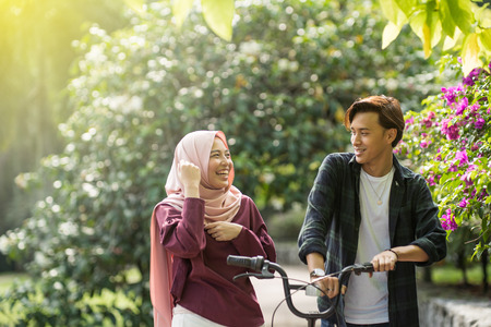 asian young friends chilling at parkの写真素材