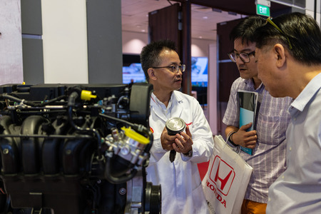 singapore -12 january 2019. shel scientist explaning people about the technology behind the engine at singapore motor showのeditorial素材