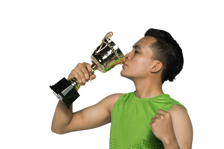 young asian man with trophies isolated in whiteの写真素材
