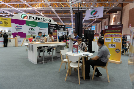 kuala lumpur, malaysia - 16 april 2019. pedoua booth with sales adviser at kuala lumpur motor showのeditorial素材