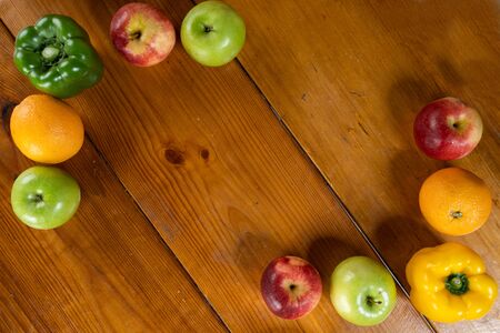 framing fruits with brown wooden backgroundの写真素材