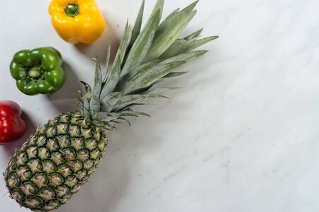 fresh pineapple and capsicum with marble backgroundの写真素材