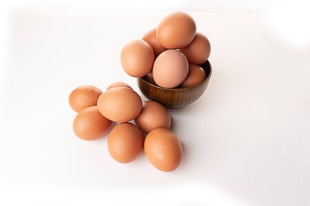 brown chicken egg isolated in whiteの写真素材