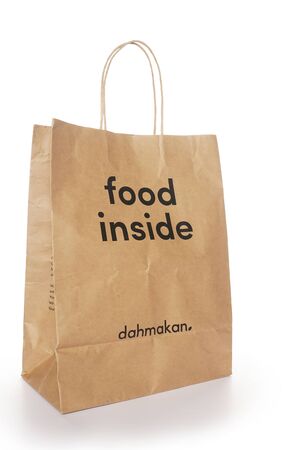 Shah Alam, Malaysia - 1 November 2019, Dah Makan take away paper bag isolated on a White backgroundの写真素材
