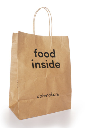 Shah Alam, Malaysia - 1 November 2019, Dah Makan take away paper bag isolated on a White backgroundのeditorial素材