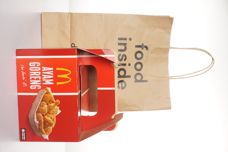 Shah Alam, Malaysia - 1 November 2019, Dah Makan take away paper bag with McDonalds Packaging isolated on a White backgroundのeditorial素材