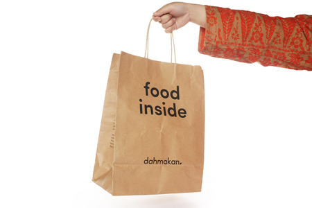 Shah Alam, Malaysia - 1 November 2019, Dah Makan take away paper bag isolated on a White backgroundのeditorial素材