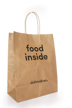 Shah Alam, Malaysia - 1 November 2019, Dah Makan take away paper bag isolated on a White backgroundのeditorial素材