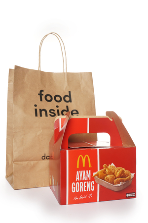 Shah Alam, Malaysia - 1 November 2019, Dah Makan take away paper bag with McDonalds Packaging isolated on a White backgroundのeditorial素材