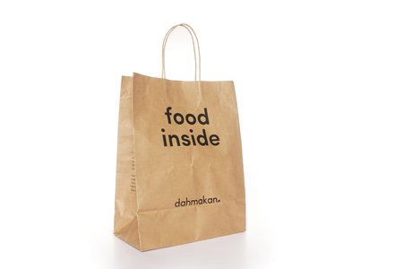 Shah Alam, Malaysia - 1 November 2019, Dah Makan take away paper bag isolated on a White backgroundのeditorial素材