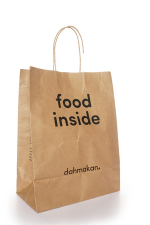 Shah Alam, Malaysia - 1 November 2019, Dah Makan take away paper bag isolated on a White backgroundのeditorial素材