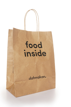 Shah Alam, Malaysia - 1 November 2019, Dah Makan take away paper bag isolated on a White backgroundのeditorial素材