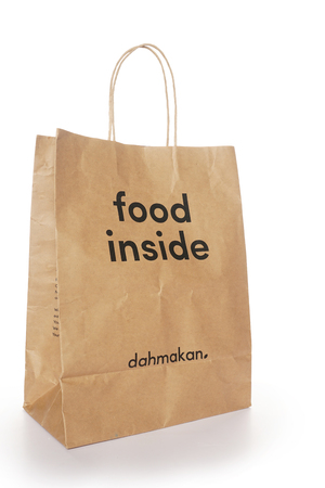 Shah Alam, Malaysia - 1 November 2019, Dah Makan take away paper bag isolated on a White backgroundのeditorial素材