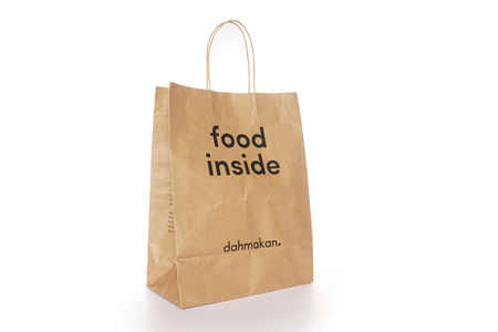 Shah Alam, Malaysia - 1 November 2019, Dah Makan take away paper bag isolated on a White backgroundのeditorial素材