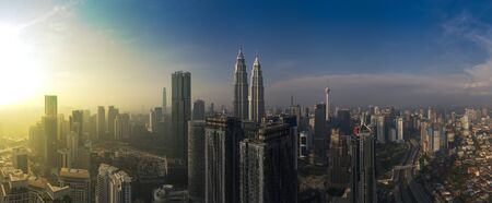 kuala lumpur buildings with dramatic sunrise aerial panorama shotの写真素材