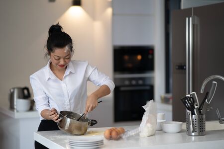 The action of the woman making the breadの写真素材