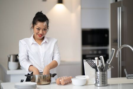 The action of the woman making the breadの写真素材