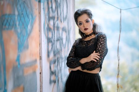 Fashion model in fantasy dress posing. Gothic actionの写真素材