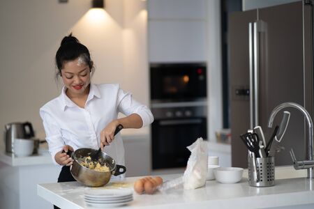 The action of the woman making the breadの写真素材