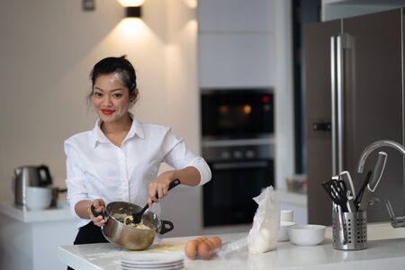 The action of the woman making the breadの写真素材