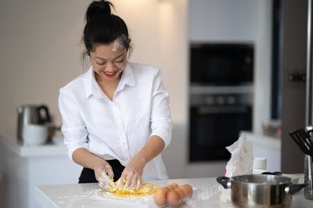 The action of the woman making the breadの写真素材