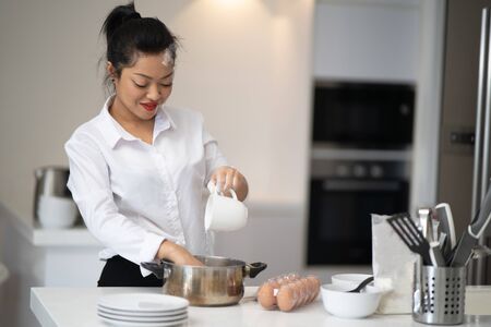 The action of the woman making the breadの写真素材