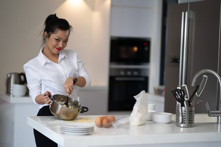 The action of the woman making the breadの写真素材