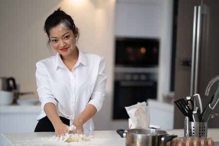 The action of the woman making the breadの写真素材