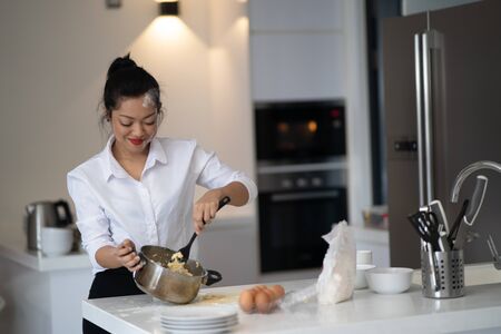 The action of the woman making the breadの写真素材