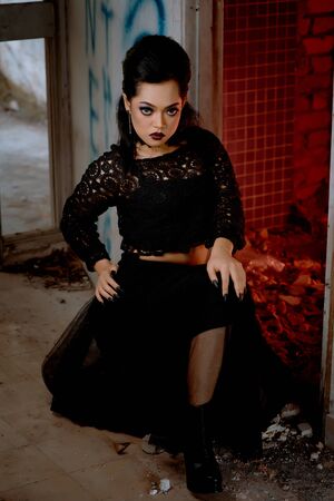 full length portrait of a pretty brunette woman wearing black leather fantasy costume.の写真素材