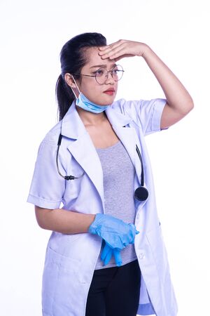 Stressed medical doctor woman on a white backgroundの写真素材