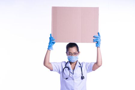 The doctor stood while holding the cardboardの写真素材