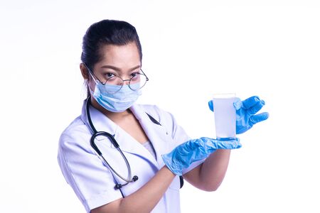 The doctor put the medicine in the water. On a white background. Health and Medical Concepts.の写真素材