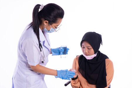 The doctor who is giving the patient the medicineの写真素材