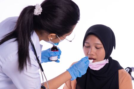 The doctor who is giving the patient the medicineの写真素材