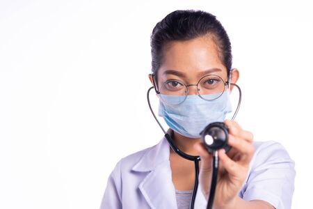 Doctors wear masks while showing stethoscopesの写真素材