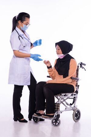 The doctor who is giving the patient the medicineの写真素材