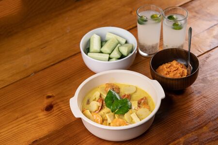 traditional malay food serve of prawn cooked with curryの写真素材