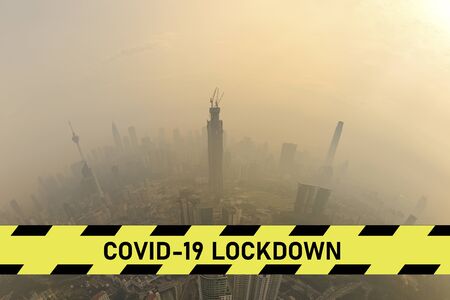 city scape with large covid-19 lockdown signの写真素材