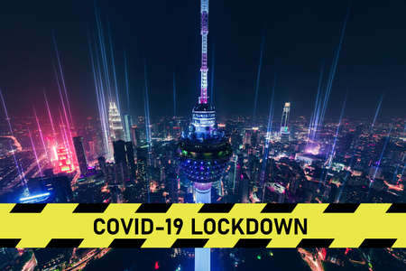 city scape with large covid-19 lockdown signの写真素材