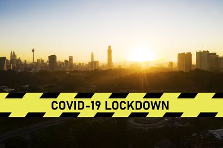 city scape with large covid-19 lockdown signの写真素材