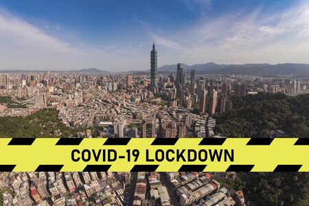 city scape with large covid-19 lockdown signの写真素材