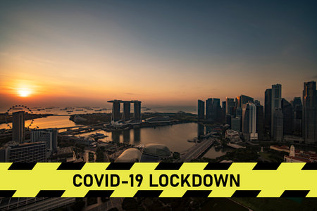 city scape with large covid-19 lockdown signの写真素材
